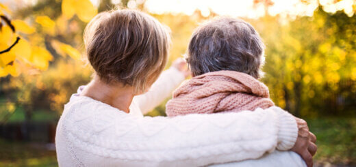 Woman and Mother with dementia looking at leaves